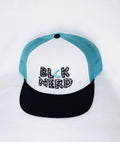 BLCK NERD BLOC PUZZLE LOGO BLCK/TEAL/ WHT TRUCKER HAT