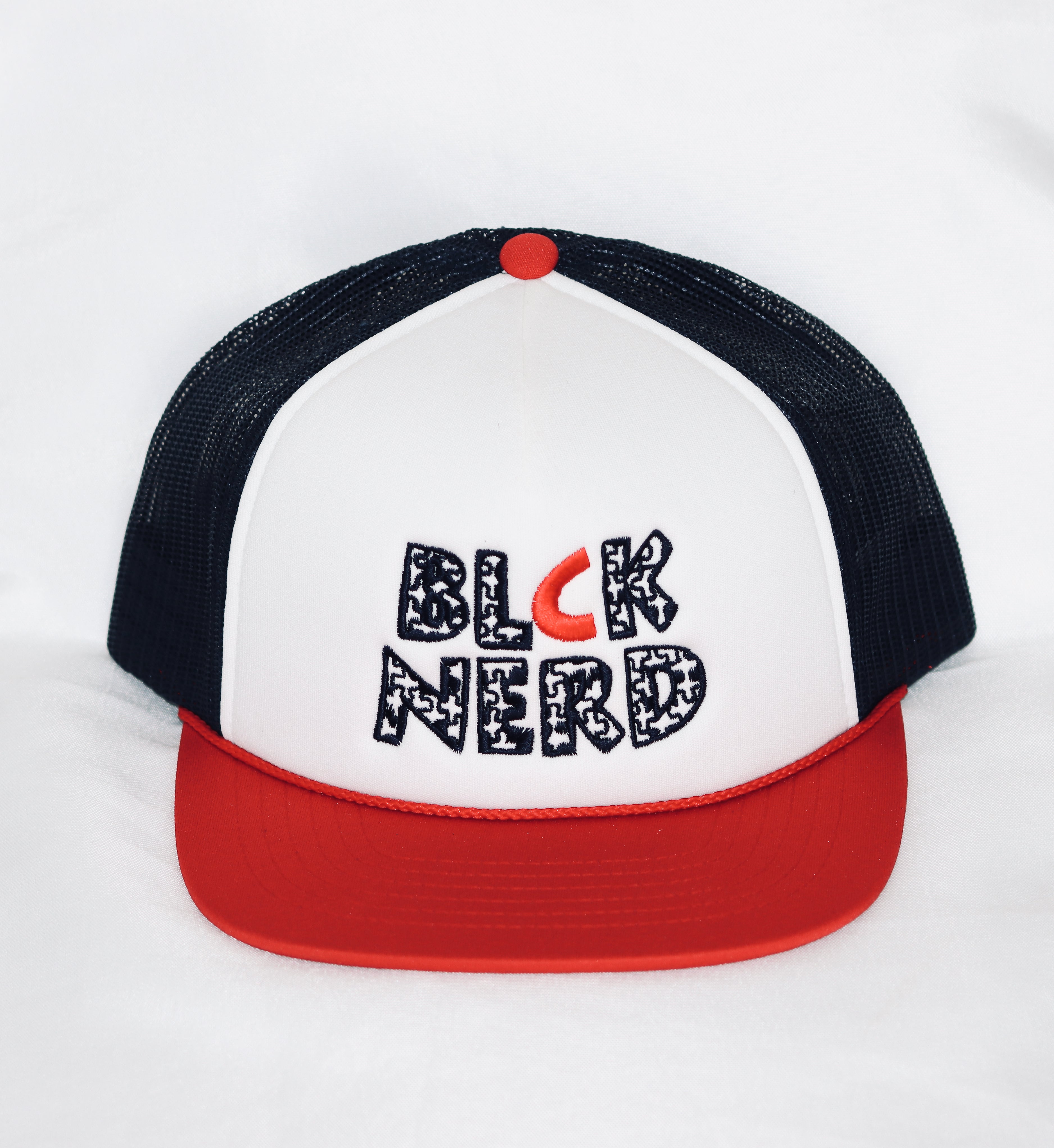 BLOCK PUZZLE LOGO BLCK/WHT/RED TRUCKER HAT